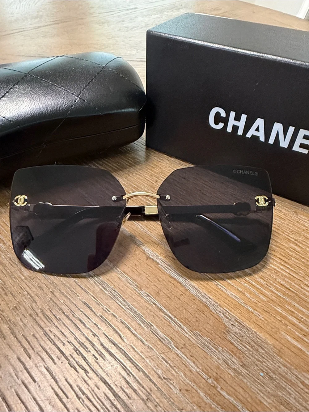 CHANEL Rimless Square Sunglasses with Dark Gradient Lenses and Gold Accents